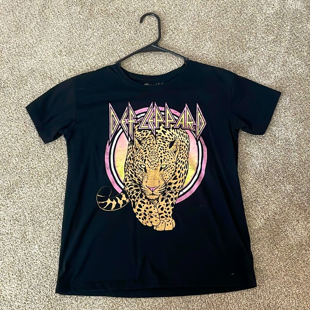 This shirt is lightly used, in good condition has only been worn about 3 times